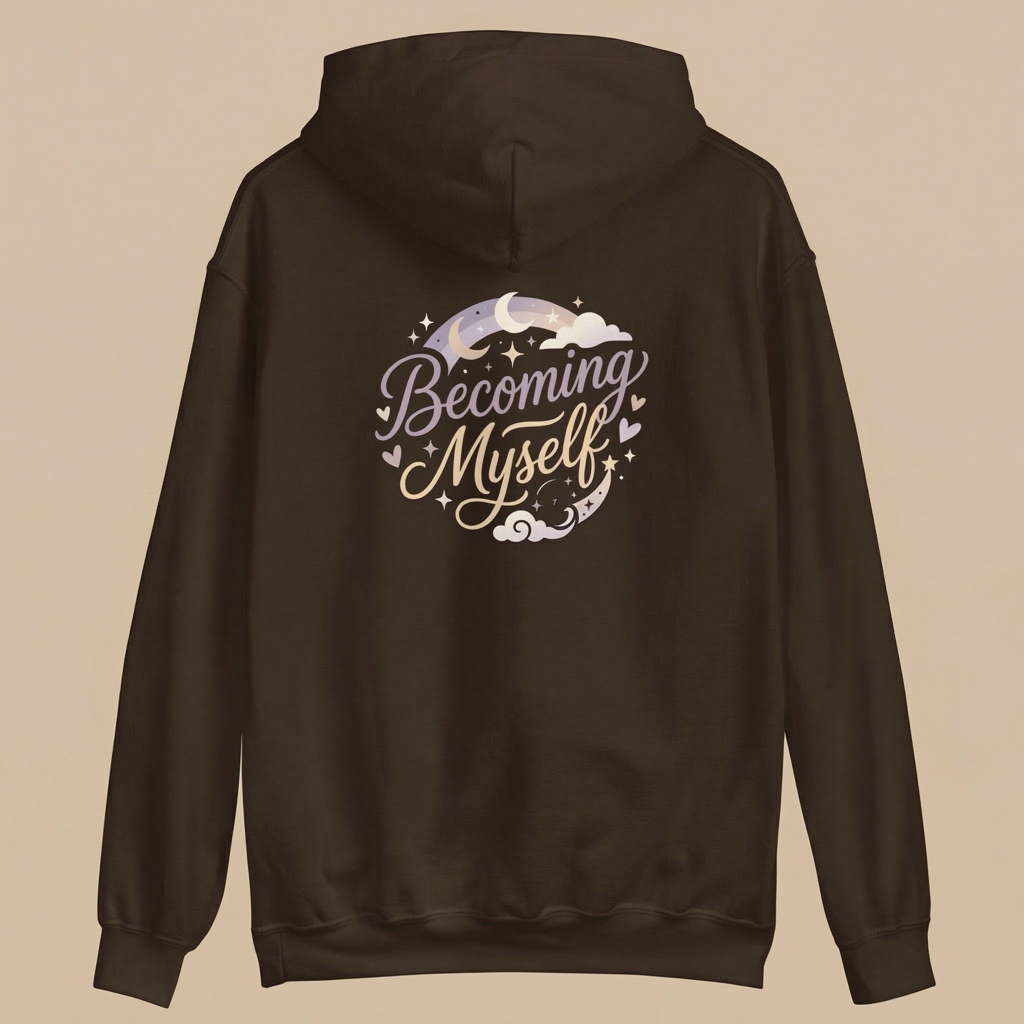 Brown hoodie with 'Becoming Myself' text on the back against a beige background