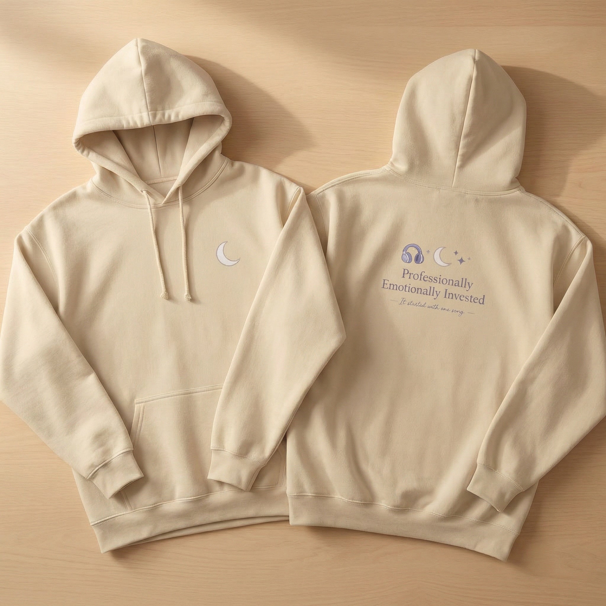 Beige hoodie with text and graphics on a beige background