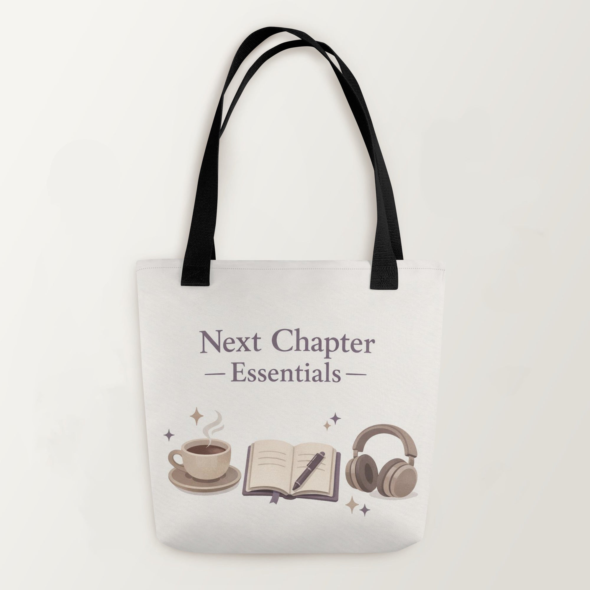 Tote bag with 'Next Chapter Essentials' text and icons on a white background