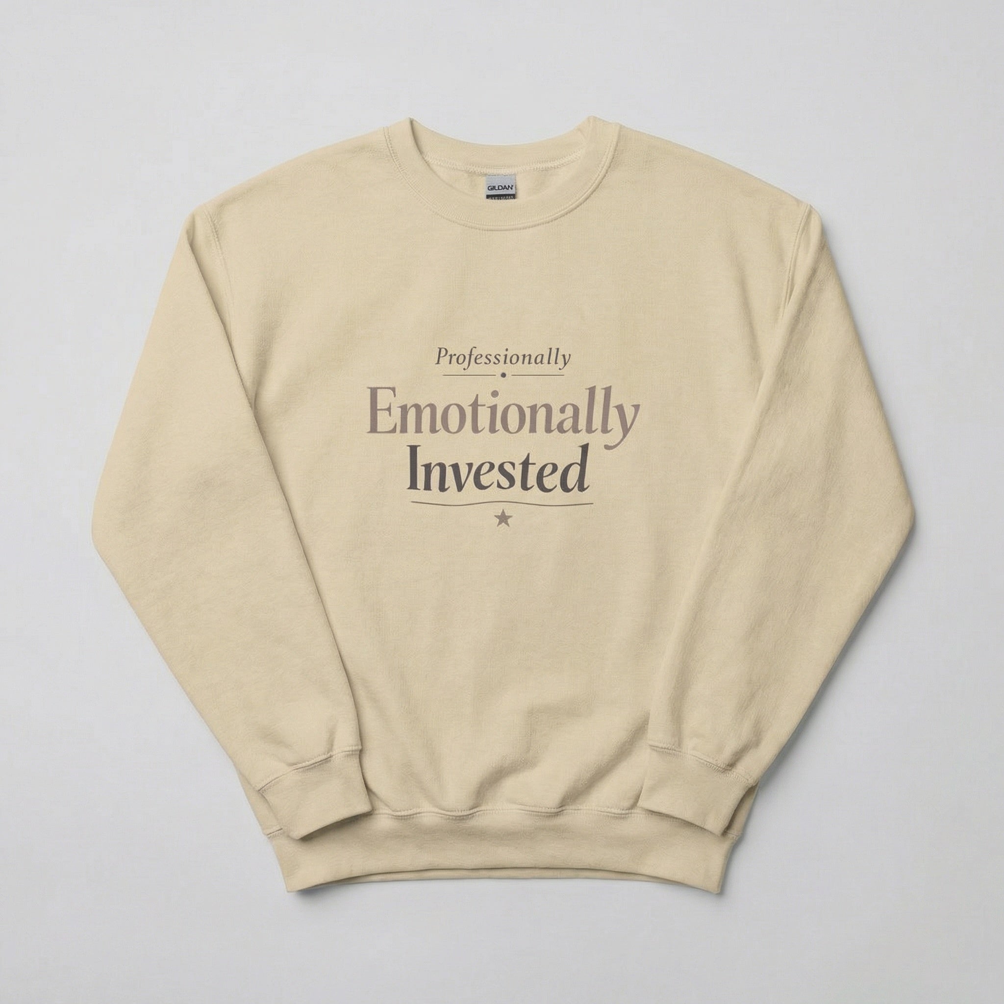 Beige sweatshirt with text 'Professionally Emotionally Invested' on a light gray background